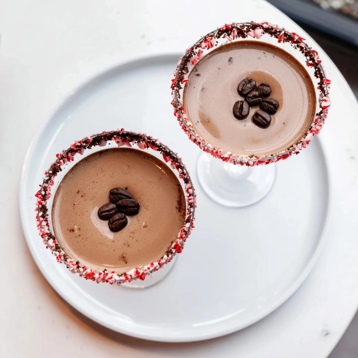 Creamy Peppermint Espresso Martini in elegant glass, garnished with espresso beans for a festive cocktail.