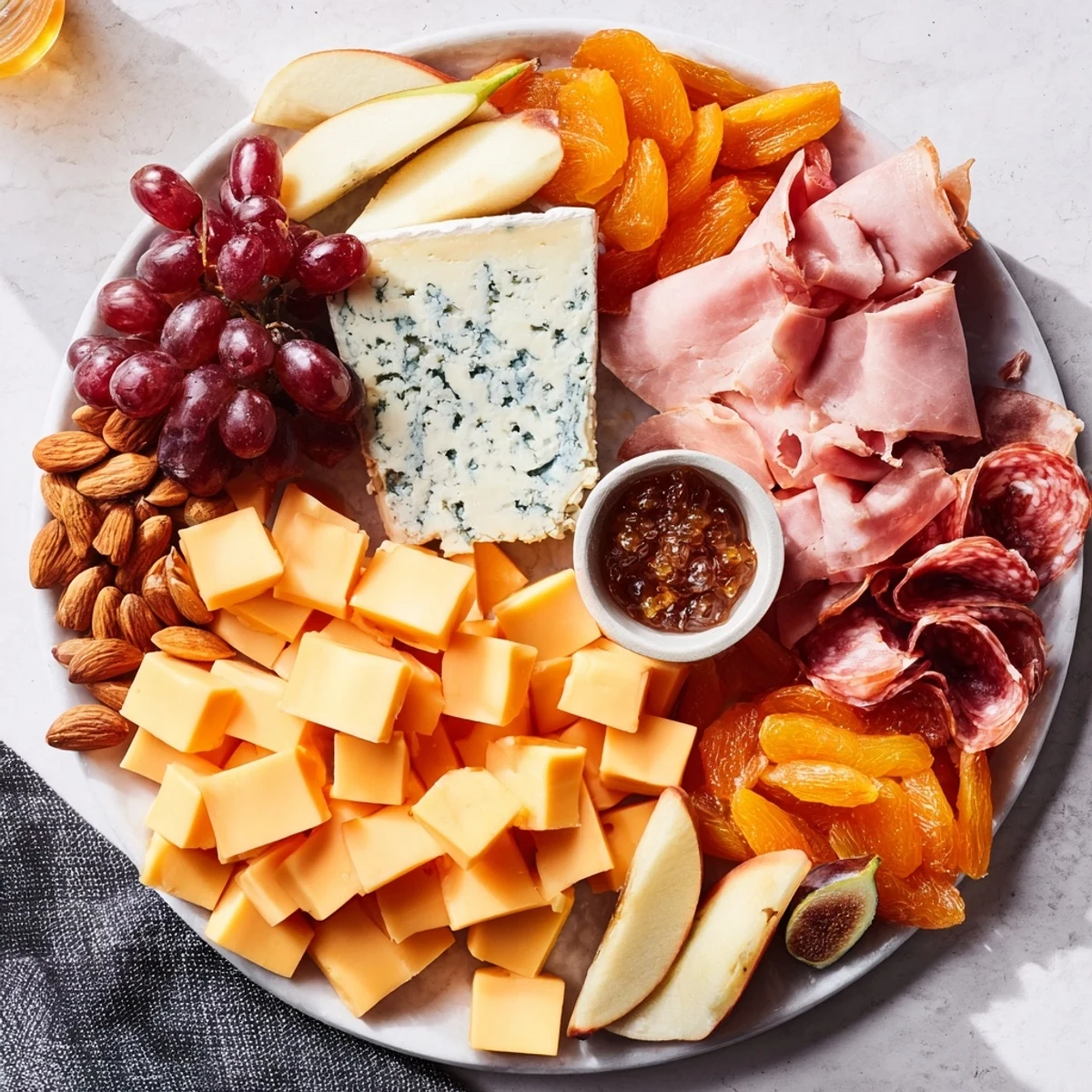 A beautifully arranged Moonlight Picnic Board featuring cheeses, fruits, and charcuterie, ready to enjoy.