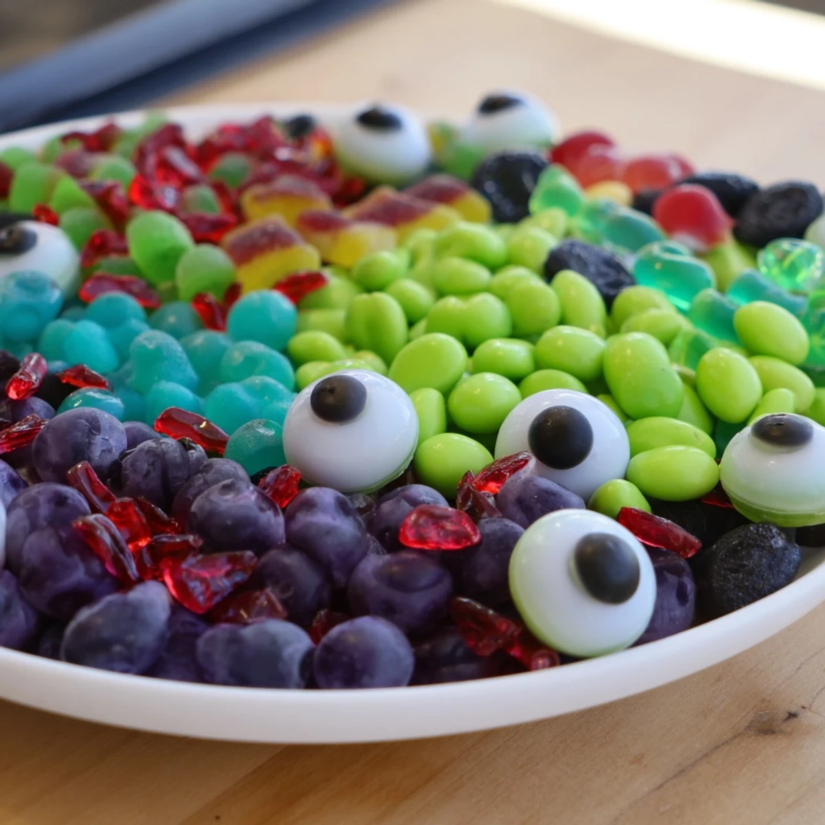 A vibrant Poison Apple Candy Platter, featuring colorful candies, perfect for Halloween gatherings.
