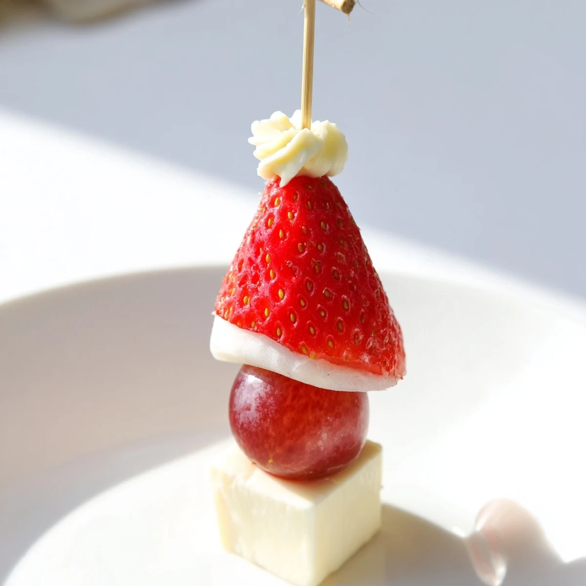 This Santa Hat Fruit and Cheese Platter is a colorful, easy appetizer, featuring festive holiday flavors.