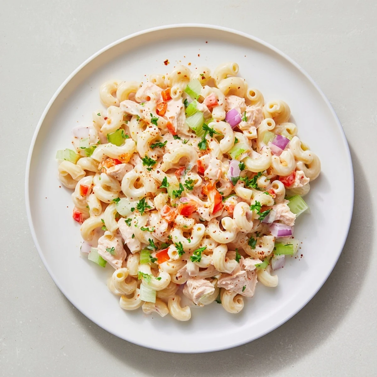 A creamy, chilled Chicken Macaroni Holiday Salad, featuring tender chicken and crisp vegetables.