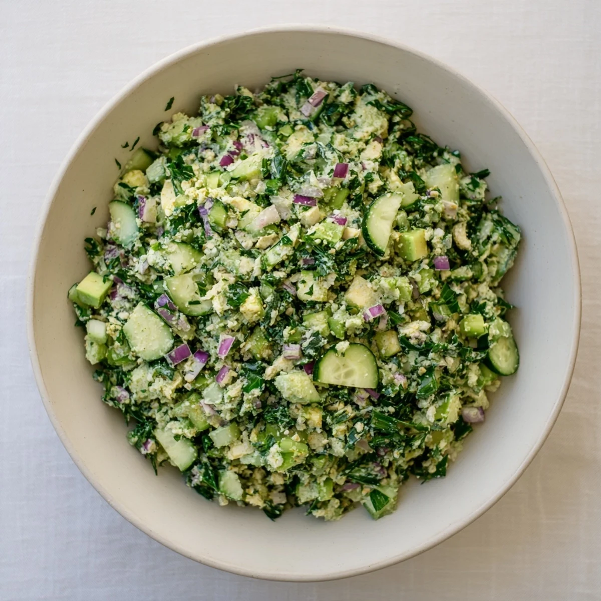 Creamy Green Goddess Cabbage Dip, a vibrant appetizer ready to scoop with crunchy chips.
