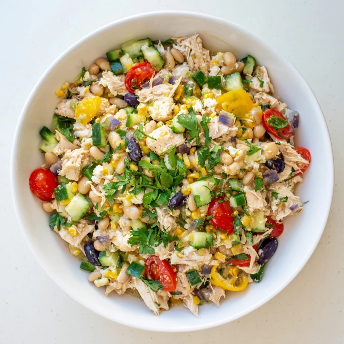 Refreshing and protein-packed: imagine the flavors of a beautiful Dense Bean Salad with Lemon-Dill Chicken.