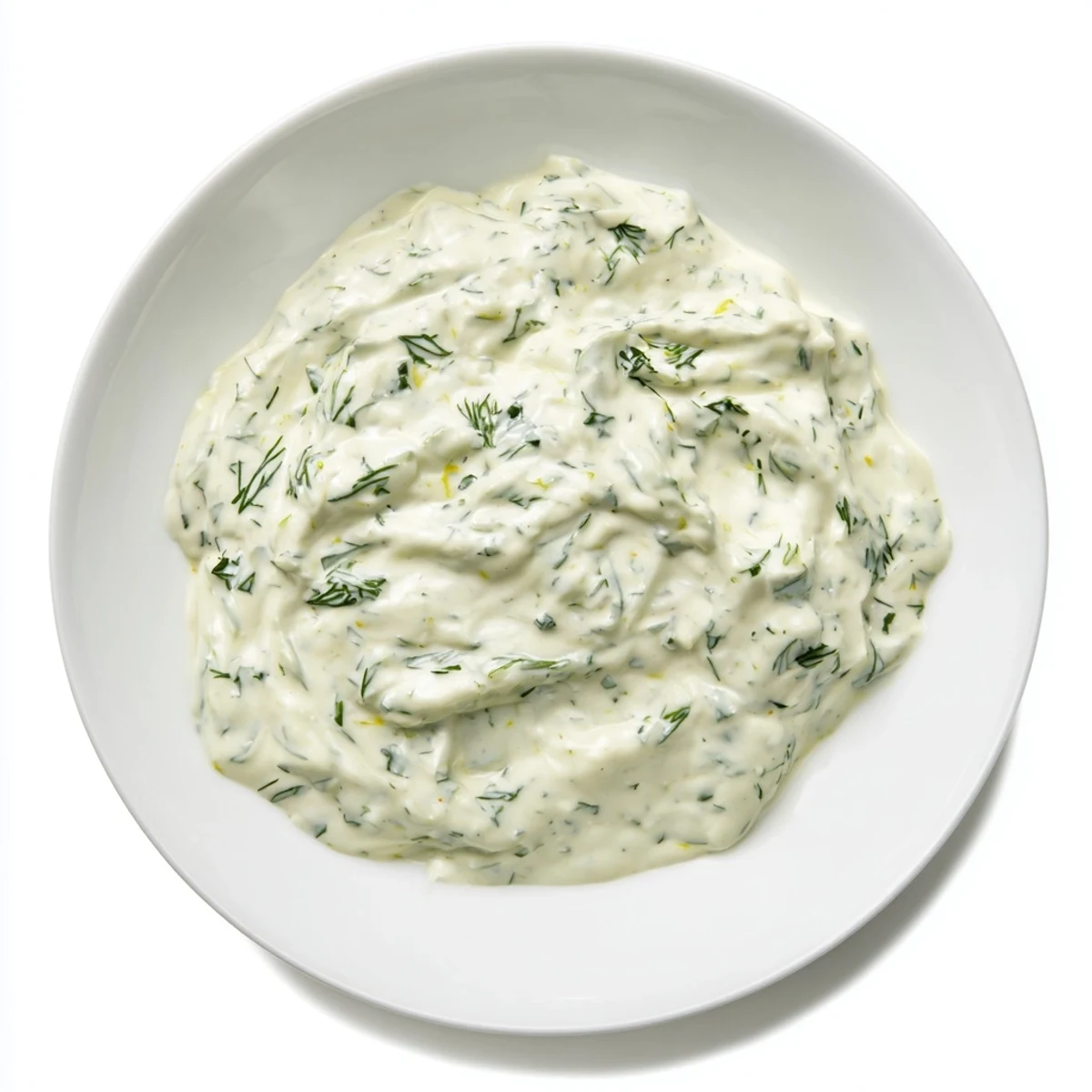 Close-up of a bowl of homemade Greek Yogurt Ranch Dip next to colorful, crisp vegetable sticks.