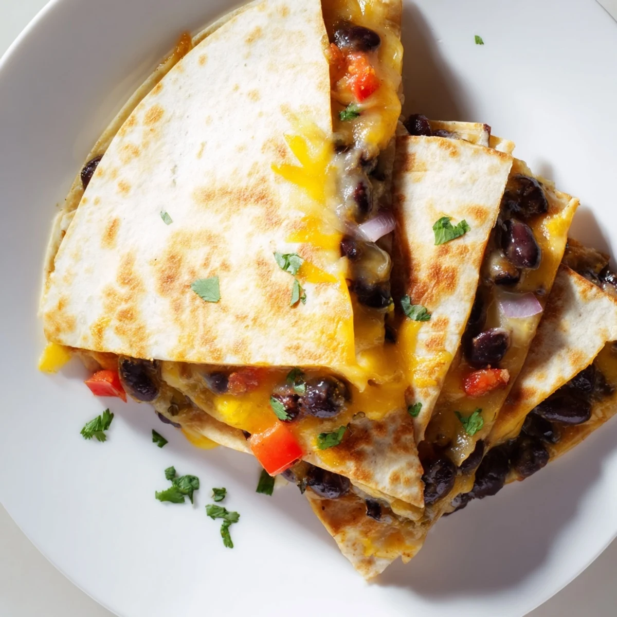 Golden-brown Black Bean Quesadilla, filled with melted cheese and savory black beans, ready to serve.