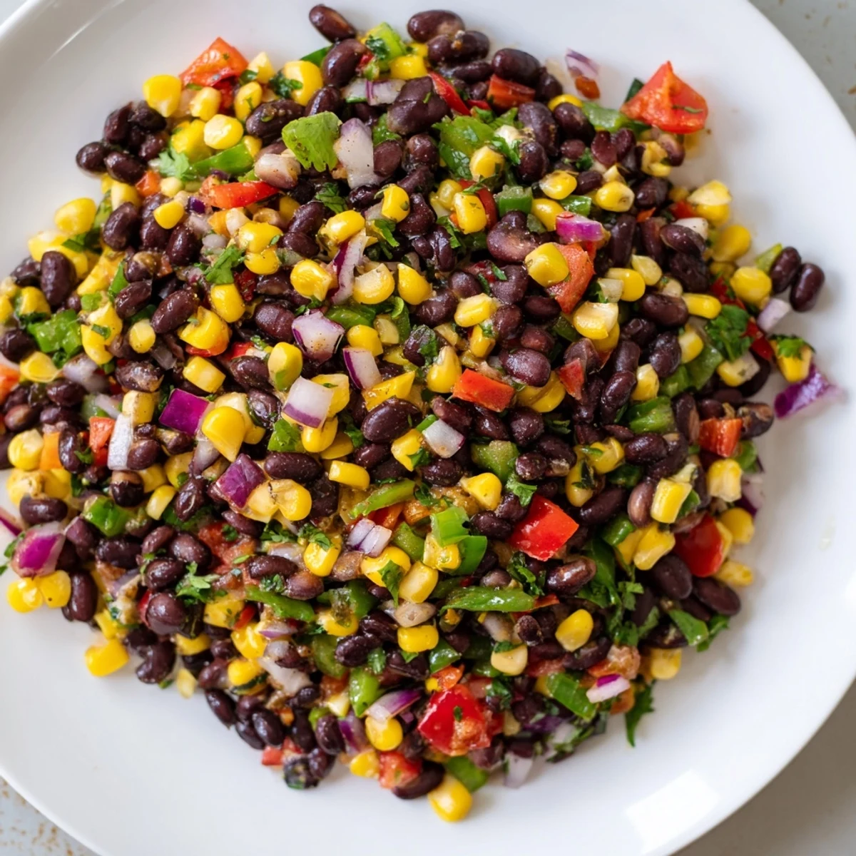 Fresh, colorful Cowboy Caviar Salad with black beans and corn, a perfect side dish.
