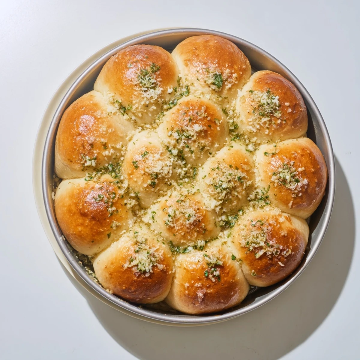 Golden-brown Garlic Butter Bread Pull-Apart rolls drizzled with fresh parsley and served warm from the oven.  