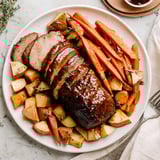 Sizzling Honey Garlic Pork Roast alongside tender root vegetables; a flavorful autumn dinner.