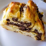 Indulge in a close-up of freshly baked crookies, showcasing the melty chocolate chips and rich layers.