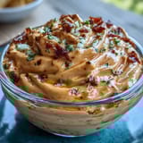 Vibrant chipotle lime mayonnaise drizzled over grilled vegetables, adding a tangy, smoky kick to every bite.