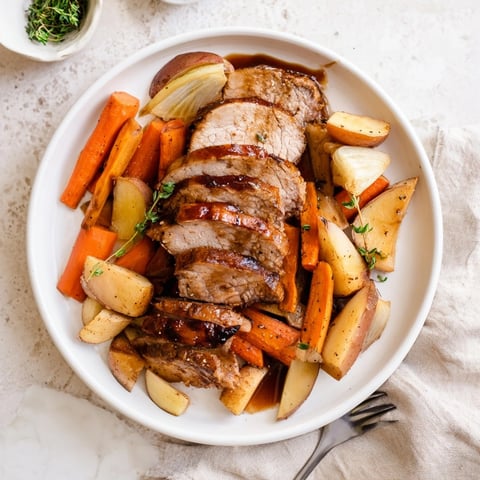 Golden Honey Garlic Pork Roast with Root Vegetables, a comforting and savory family meal.