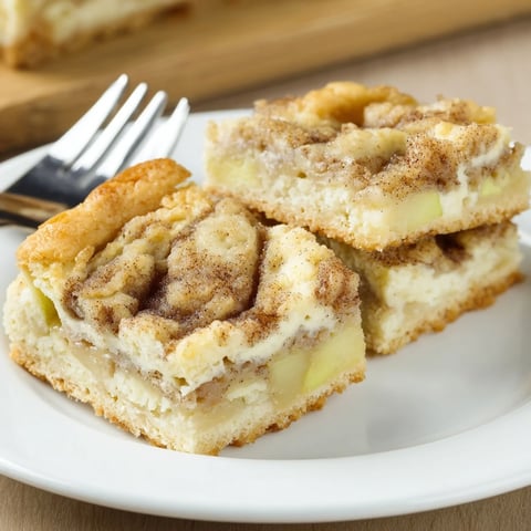 Luscious Cream Cheese Apple Cinnamon Swirl Bars with buttery crust and warm apple filling.  