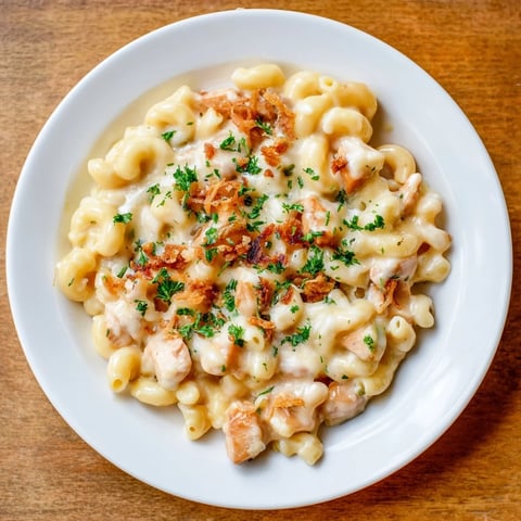 Steaming one-pot honey BBQ chicken mac and cheese, a comforting dinner with melted cheese and tender chicken.