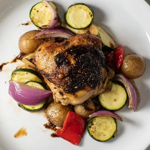 Golden, roasted Black Garlic and Balsamic Chicken on a sheet pan, ready for a delicious dinner.