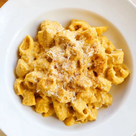 Golden baked Pumpkin Mac & Cheese with a bubbly cheese topping, ready to serve and enjoy.