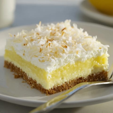 Chilled No-Bake Lemon Coconut Squares, a refreshing treat with tangy filling.  
