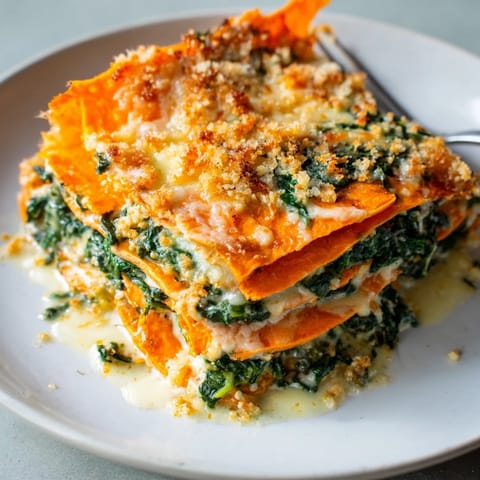 Layers of tender sweet potatoes and sautéed spinach make this gratin irresistible.  