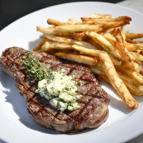 Golden, crispy fries alongside a perfectly cooked Steakhouse Garlic Butter Steak, ready to enjoy.