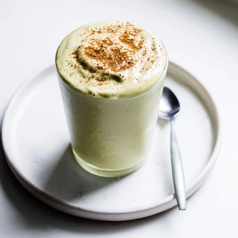 Enjoy a refreshing Matcha Snickerdoodle Protein Shake, thick and frothy, perfect for a quick, healthy breakfast.