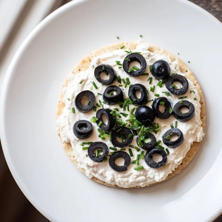 A plate of Gold Medal Olympic Ring Appetizers: colorful, bite-sized crackers ready to eat now.