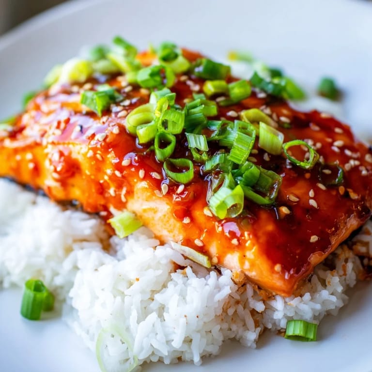 Broiled to perfection, the Sticky Orange Salmon has a caramelized glaze over flaky salmon fillets.
