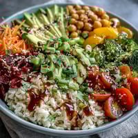Rainbow Veggie Buddha Bowl with Sesame Ginger Dressing: colorful bowl packed with fresh vegetables, grains, and zesty dressing, perfect for healthy vegan meals.  
