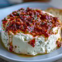 Creamy Calabrian chili cream cheese spread with a spicy kick, perfect for bagels and toast.  